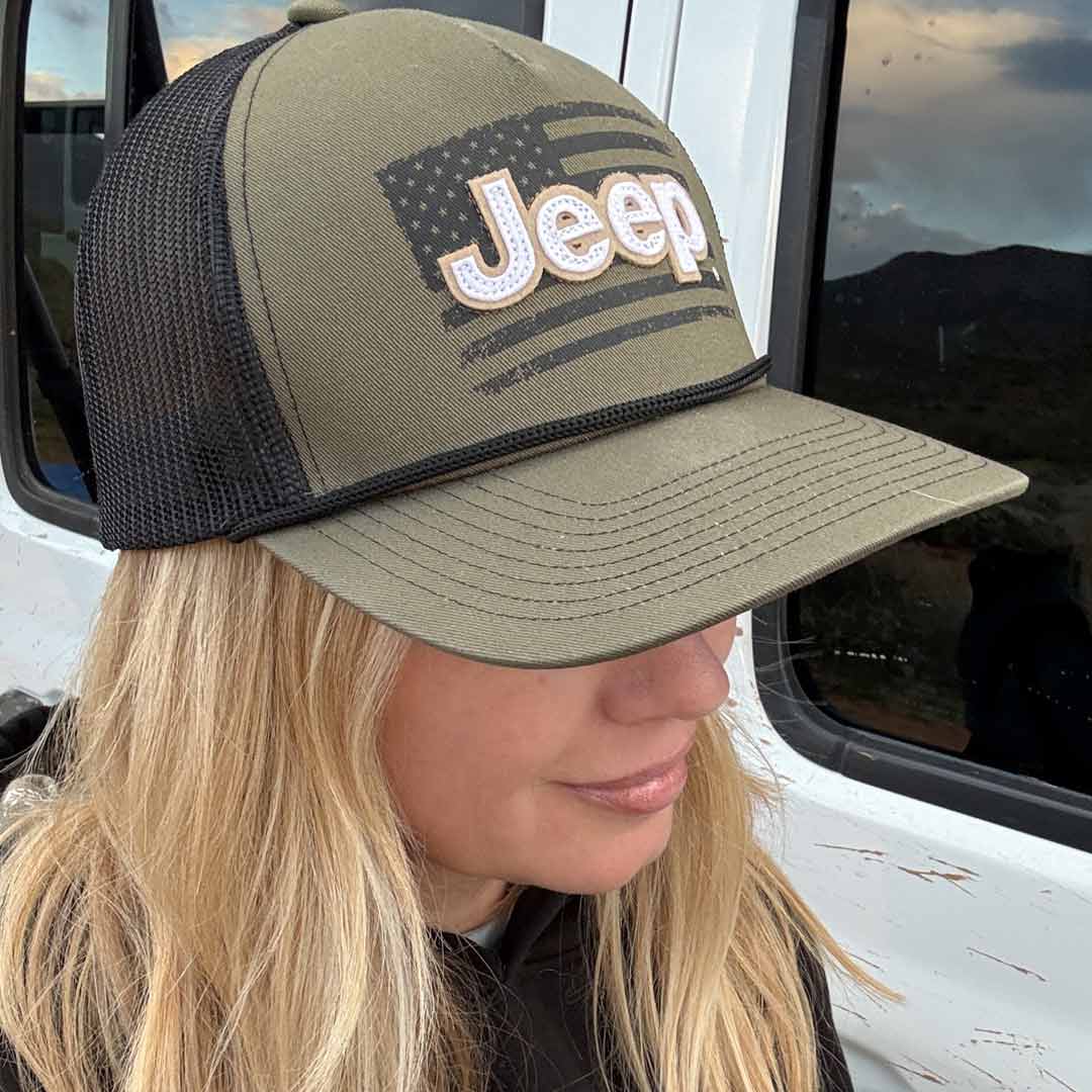 woman wearing green hat with Jeep logo and American flag