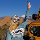 woman wearing jeep long sleeve shirt and snow camo hat