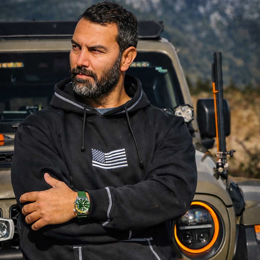 man wearing a black patriotic hoodie