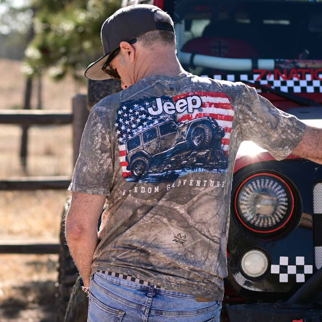 man in camo t-shirt with jeep and american flag