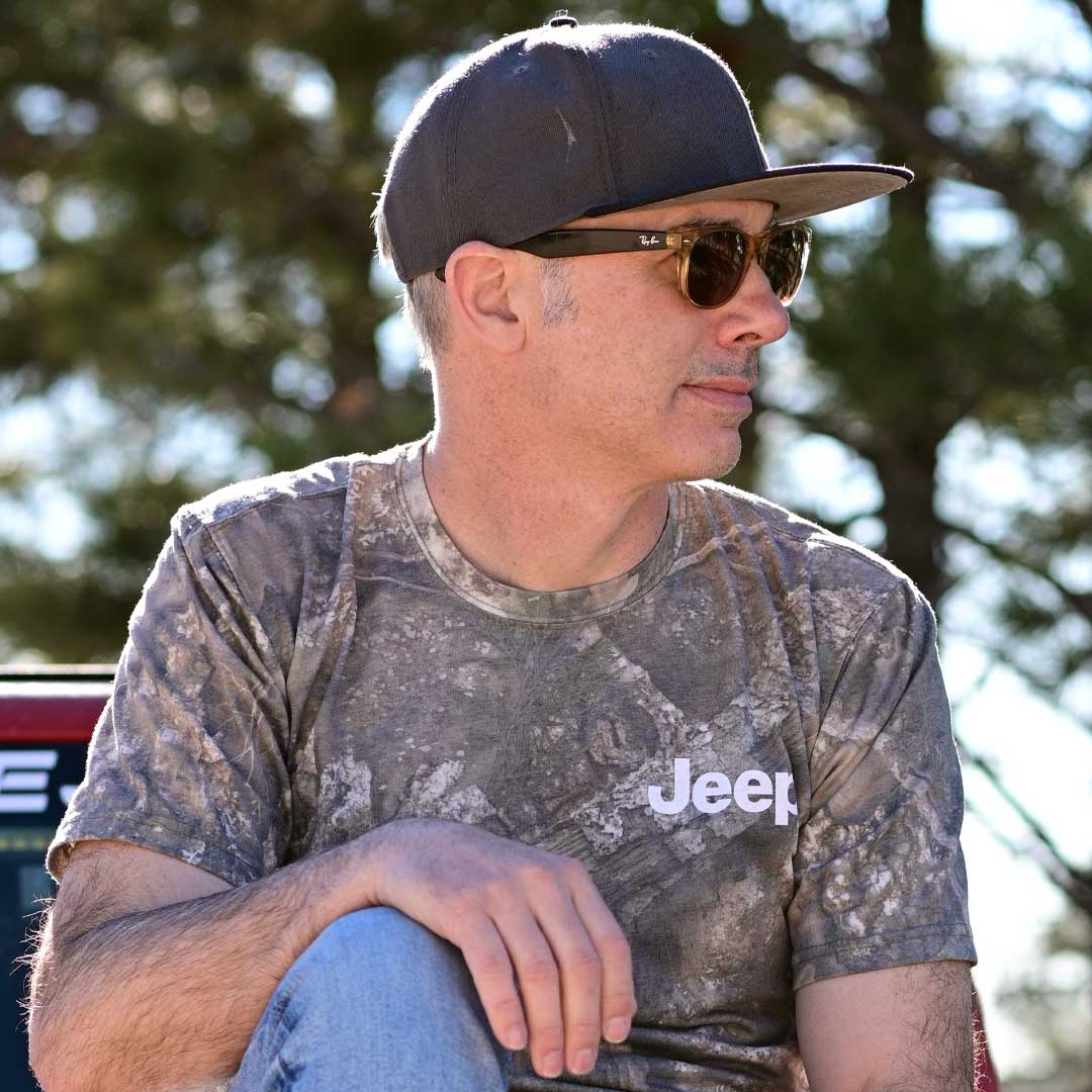 man in camo t-shirt with jeep left chest