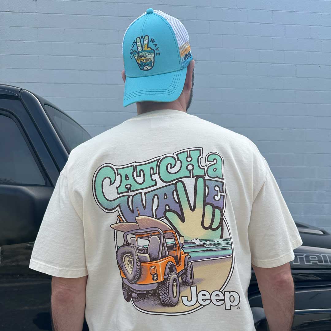 man wearing a Jeep designed snapback hat and short sleeve shirt that are summer beach style