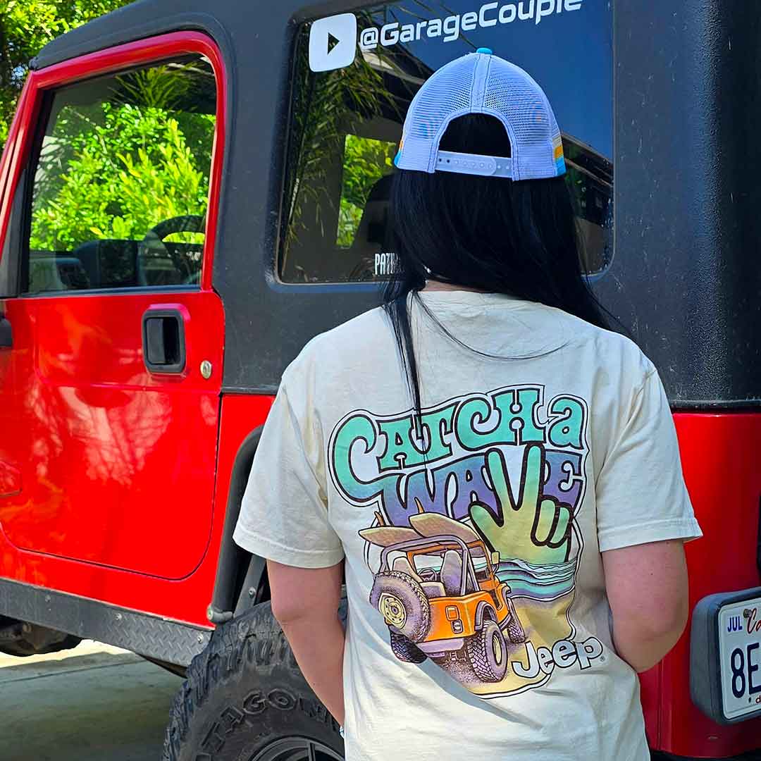 woman wearing Blue Jeep Catch a Wave trucker hat