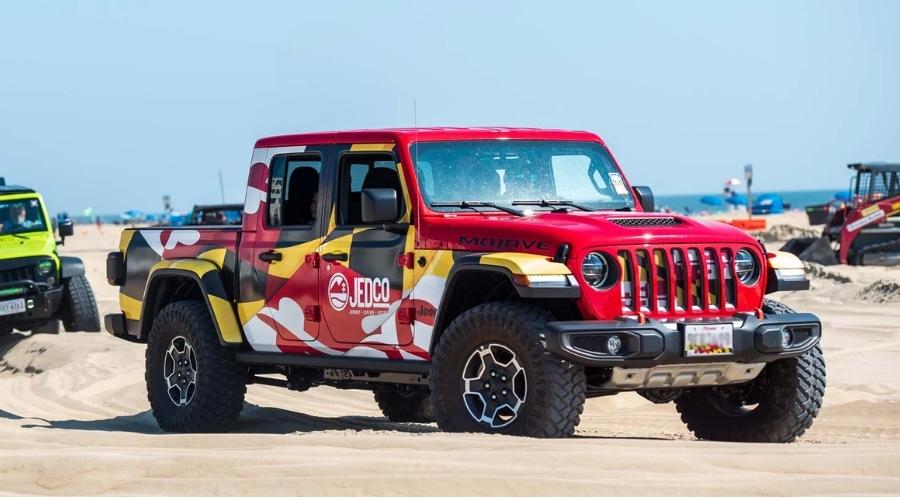 JEDCo wrapped jeep driving on the beach