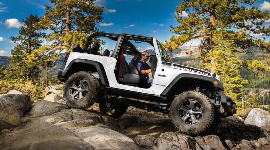 Women driving off-road in a white jeep