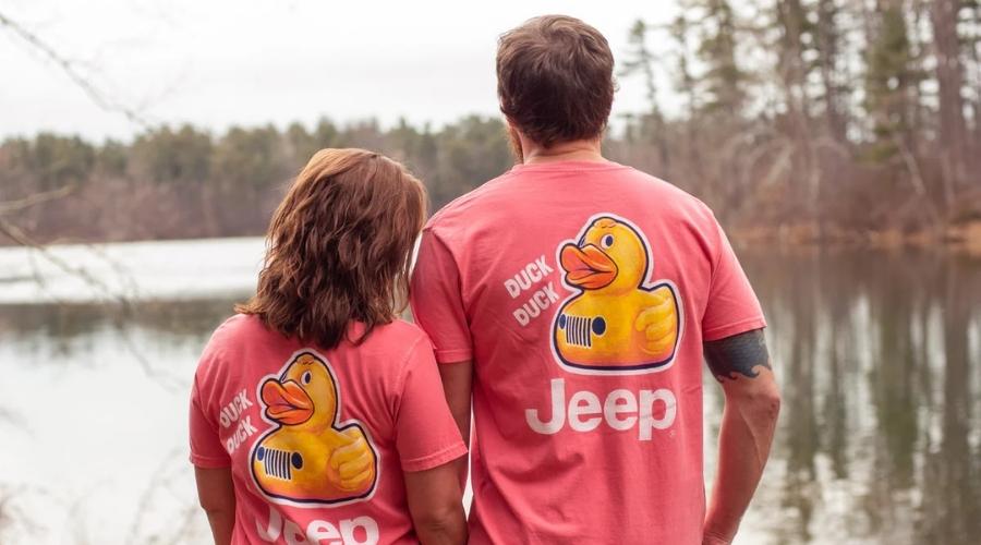 Male and female wearing a jeep duck shirt