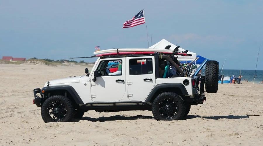 White jeep on the beach