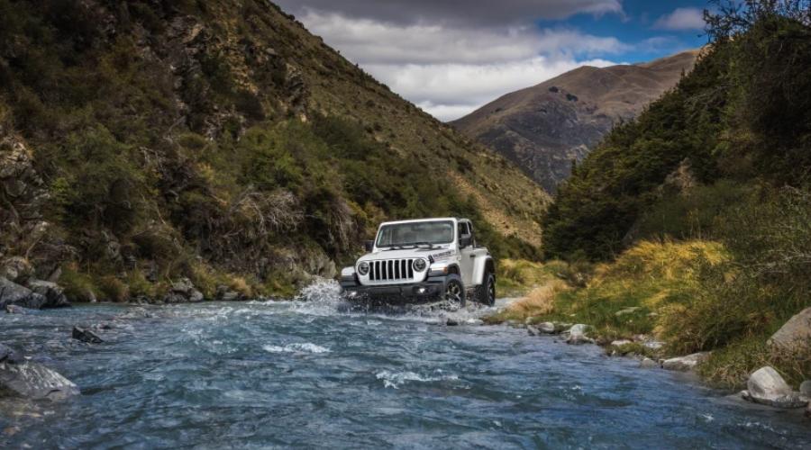 Jeep driving through a small area of water