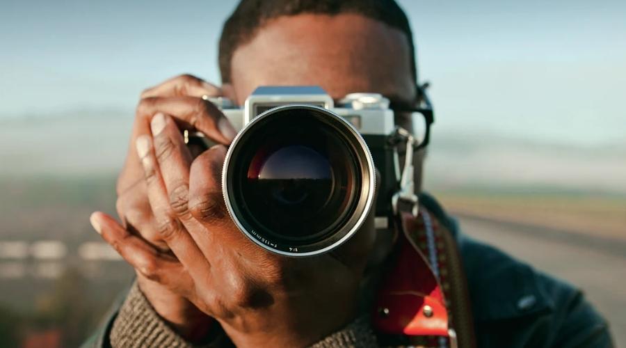 Tourist holding up a camera