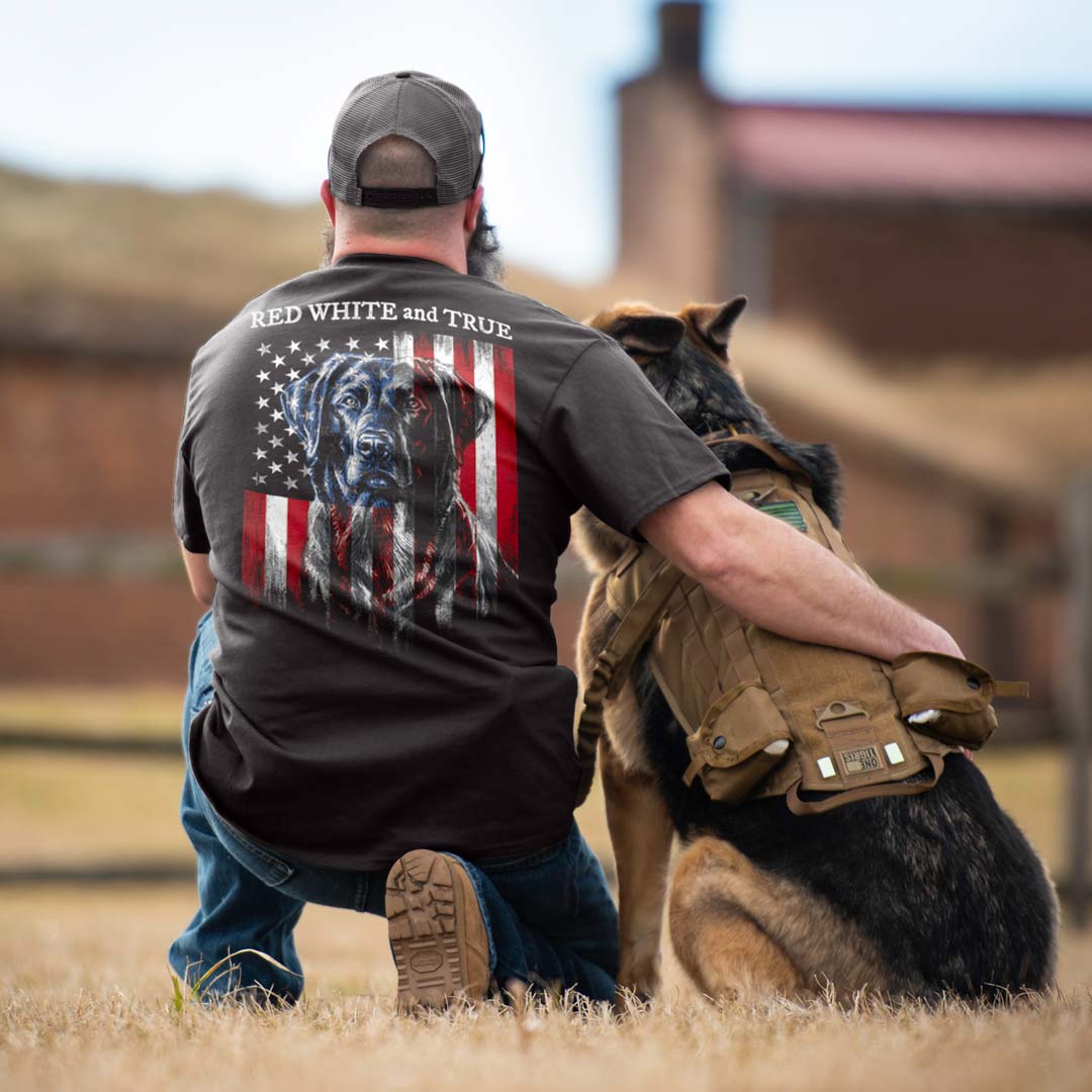 man with German Shepherd dog - man wearing a black t-shirt with dog and American flag