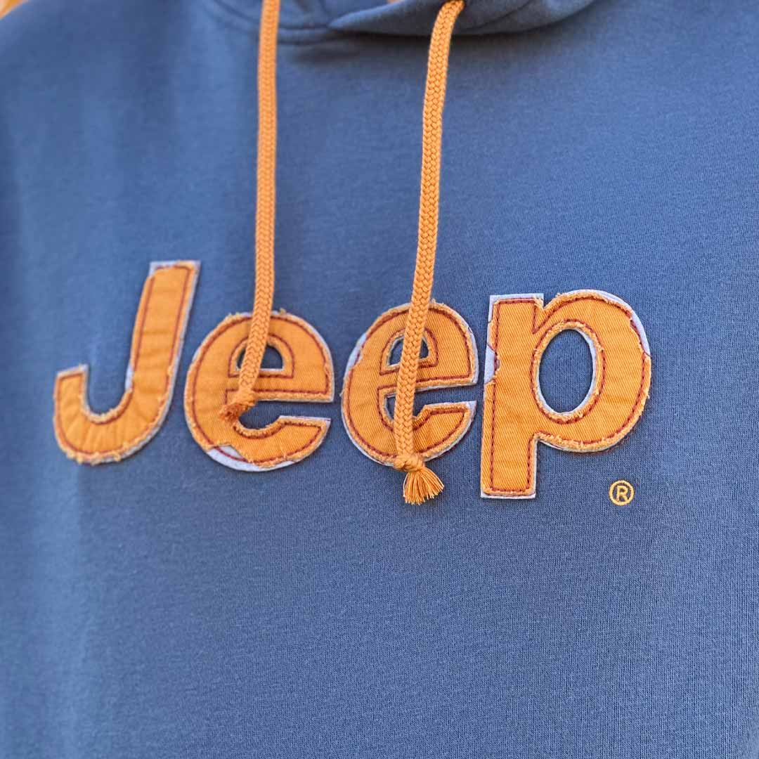 Jeep vintage hoodie with embroidered orange jeep logo on front close up