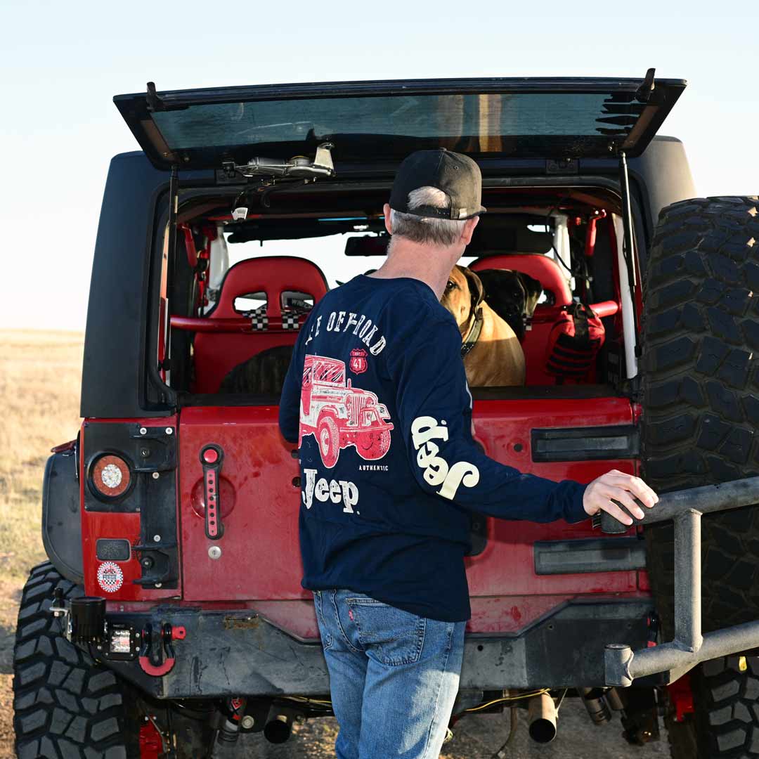male wearing jeep long sleeve shirt with jeep design on the back and logo on sleeve