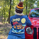 back of long sleeve shirt with a jeep off roading said "made to explore" on a woman in a jeep beanie