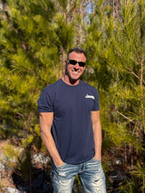 man wearing jeep shirt with brand logo on left chest outdoors