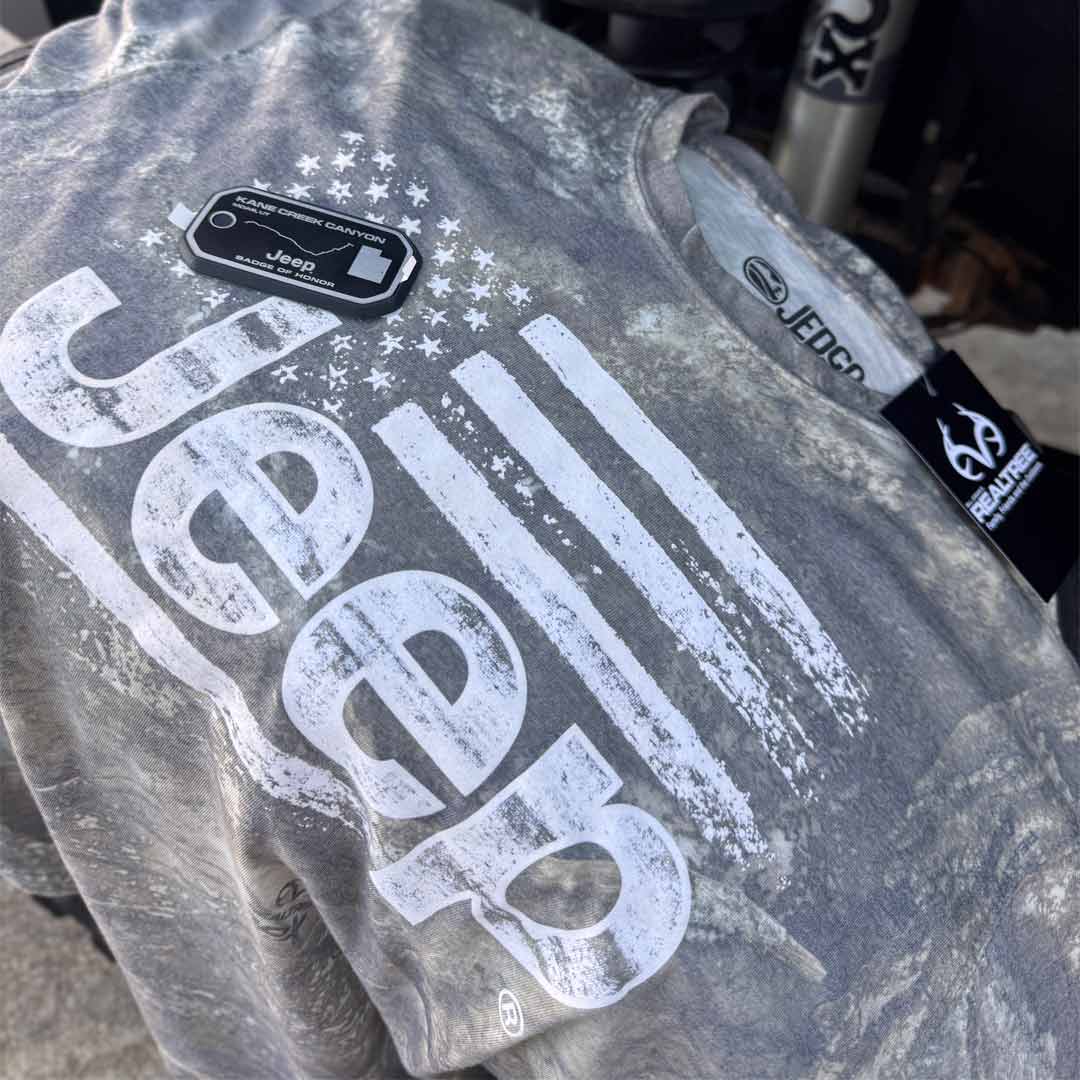 Realtree APX camo t-shirt with Jeep logo and American flag on the front
