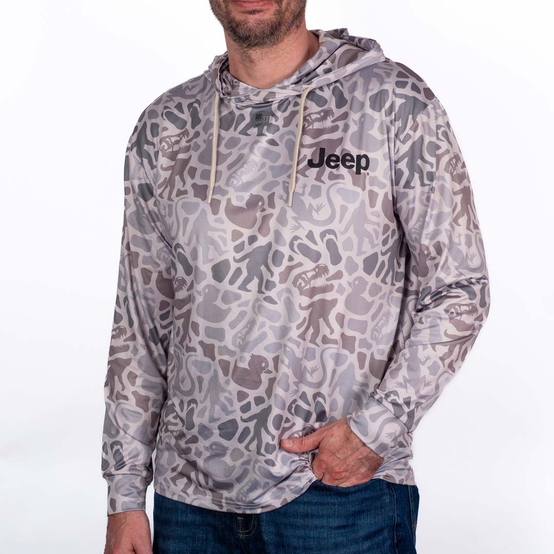 Person wearing a camouflage Jeep Easter Egg Performance hoodie with Jeep logo on the left chest. White background. Front.