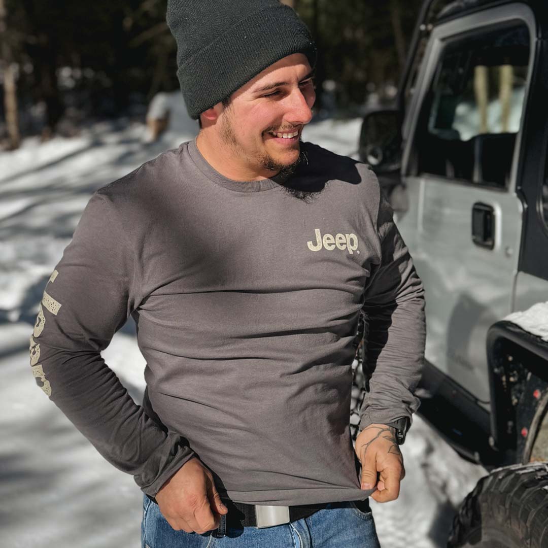 Man wearing a gray long sleeve Jeep t-shirt 
