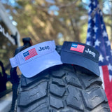 two jeep visors, white and navy, with the american flag with a jeep grille in the navy stars area and the jeep logo next to it